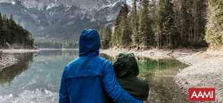 Couple looking at mountain lake