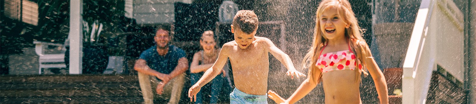 Children playing in a sprinkler