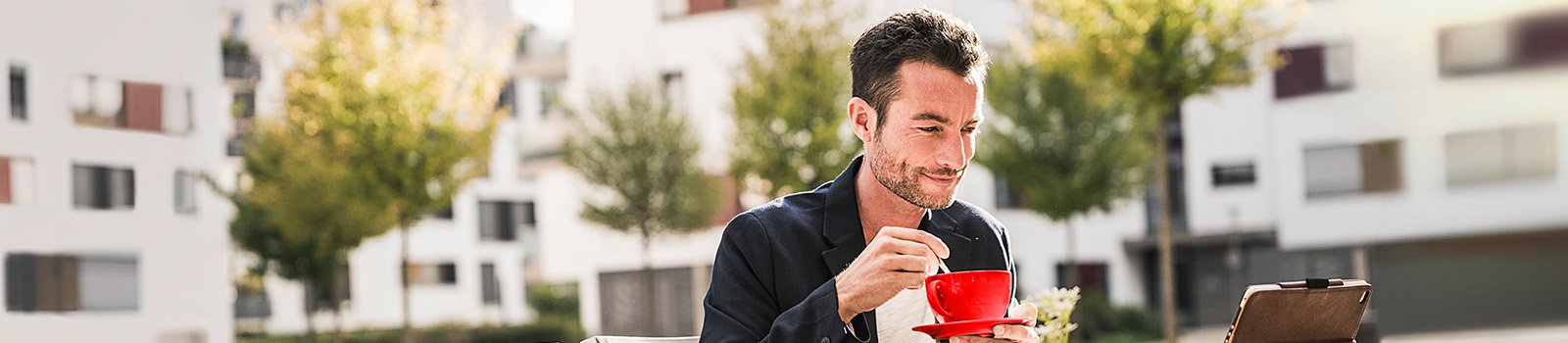 Man sitting at cafe drinking coffee