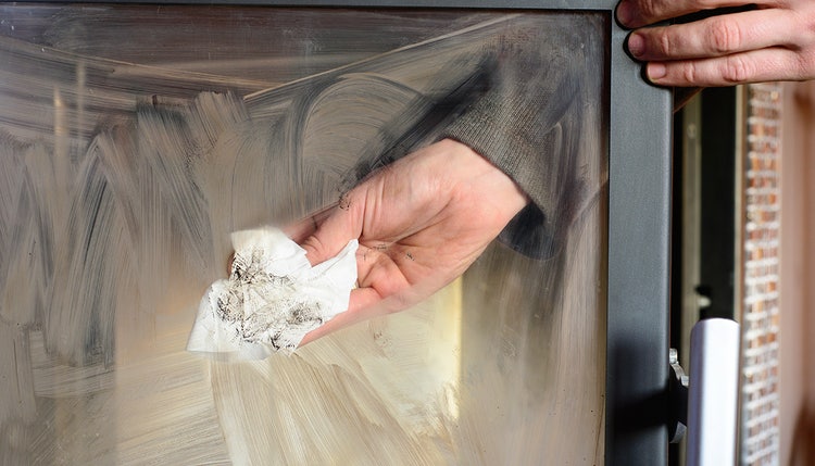 A person cleaning their damper.