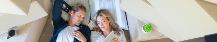 Couple resting after moving house.