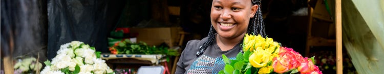 woman preparing to make contactless payment for flowers