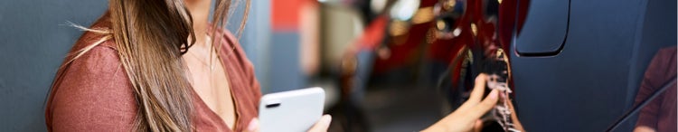 woman filling car with petrol