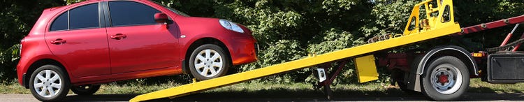 broken red car and tow truck