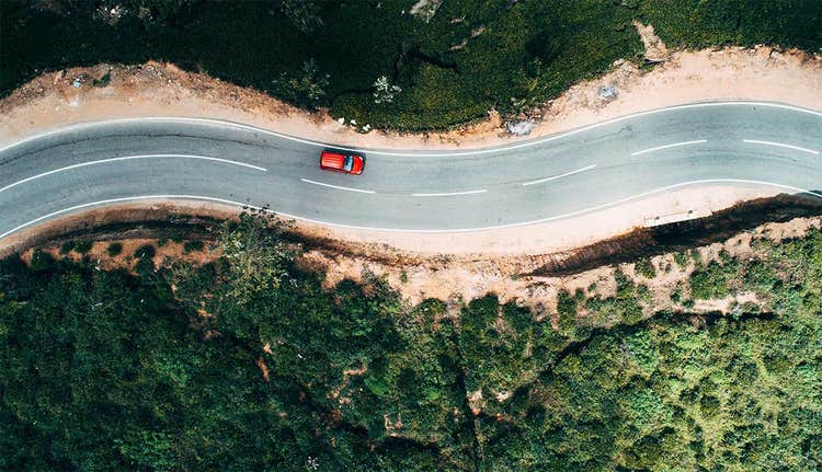 aerial view of red car on the road