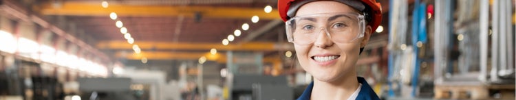 woman in safety gear in factory