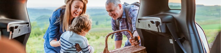 family in boot of car