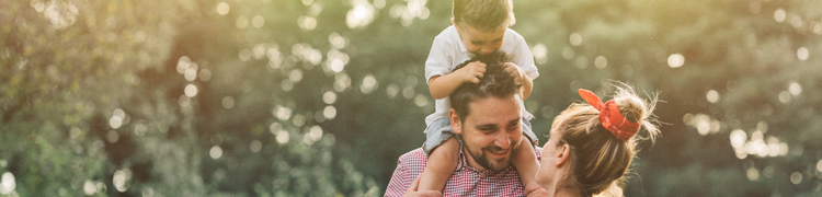 boy on dads shoulders