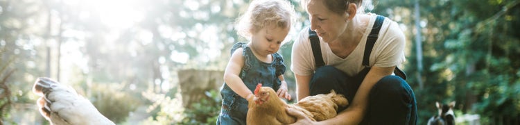 mum and daughter with chicken