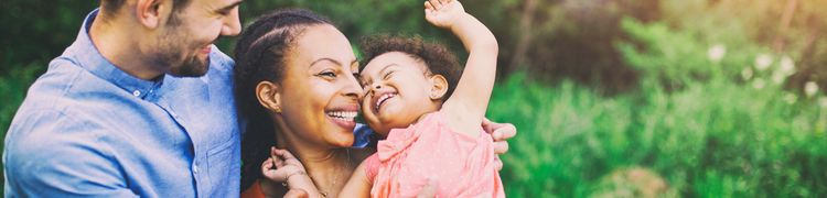 parents hugging child