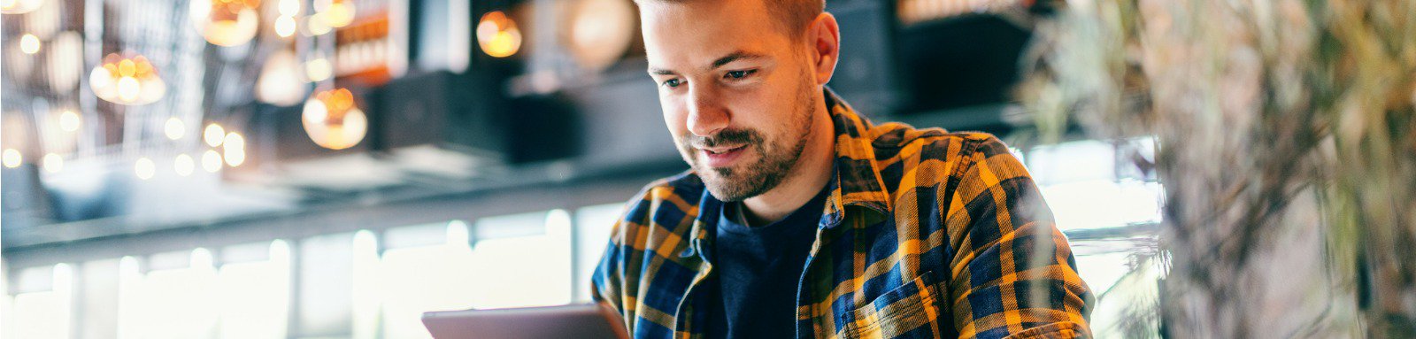 A man looking for term insurance on Ipad