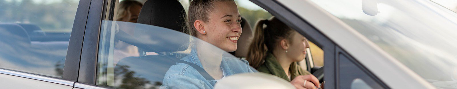 Three women riding in car