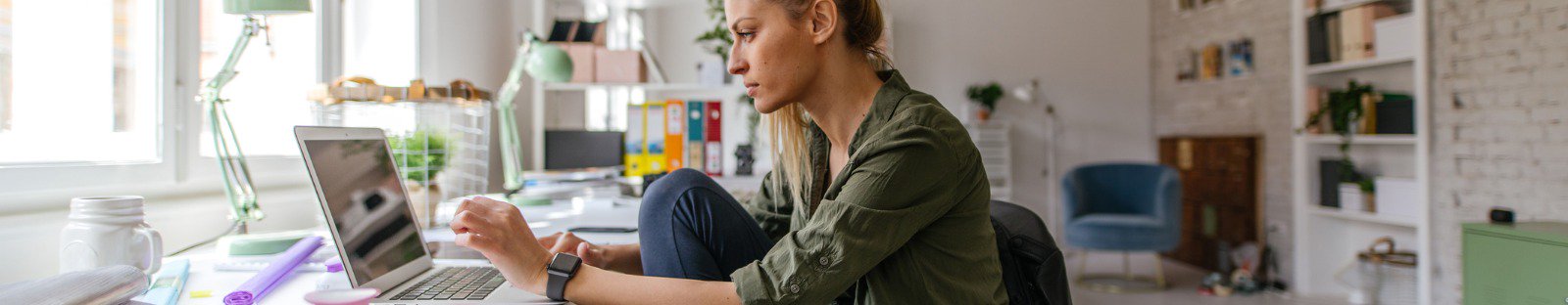 woman working on laptop at desk