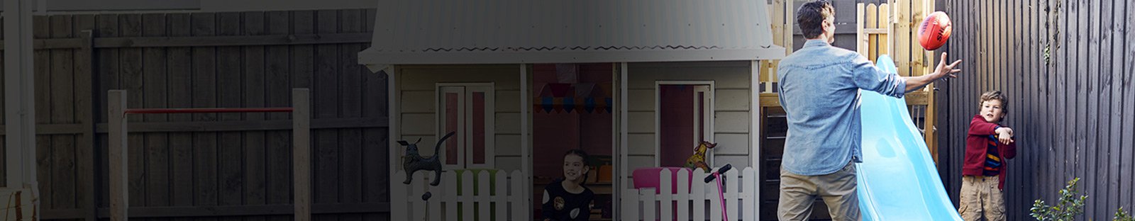 Man playing with his kids in backyard