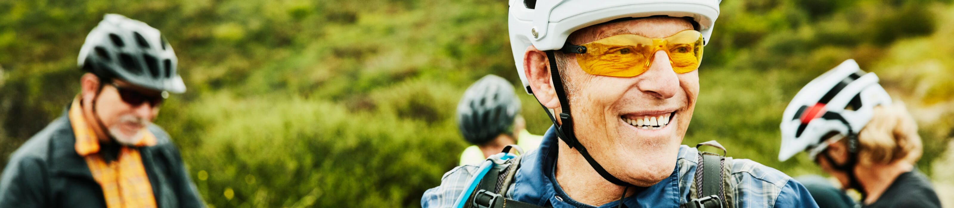 Group of mature cyclists with helments on