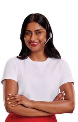 A professional woman dressed in a white t-shirt and wearing a headset is looking at the camera with her arms crossed and smiling