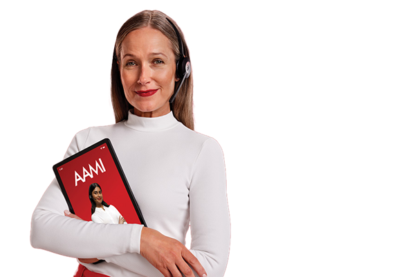 Woman with dark blonde hair wearing a headset and cradling an iPad showing an AAMI screen