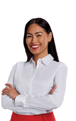 Smiling professional woman with long black hair and wearing a white collared shirt has her arms crossed