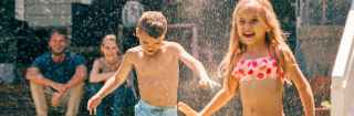 Children playing in a sprinkler