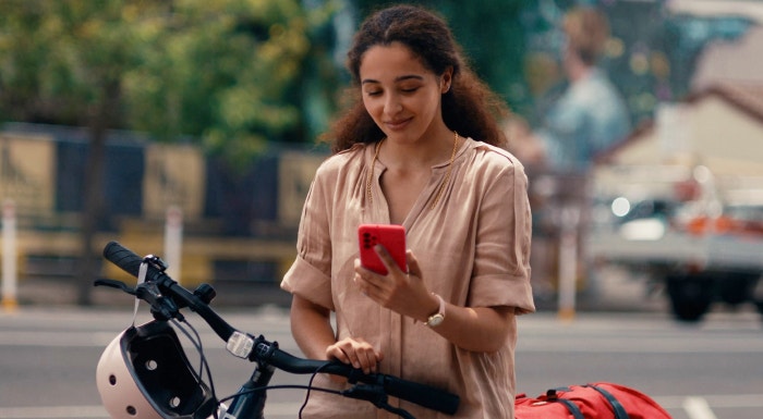 Woman with bike on phone