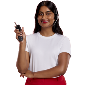 Professional woman is smiling and holding up keys