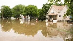 House in street submerged in flood waters