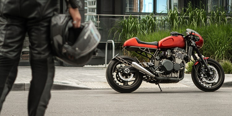 Red motorcycle parked on street