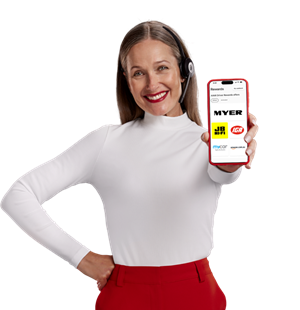 AAMI Woman wearing a headset smiling and holding a smartphone showing the AAMI App