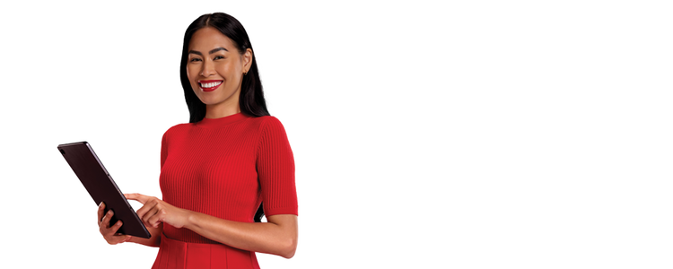 Professional woman is smiling while using an iPad