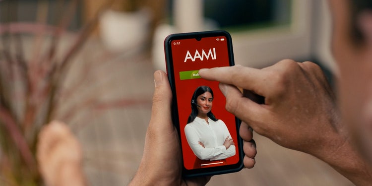 Close up of a hand using the AAMI App on a smartphone