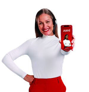 AAMI Woman wearing a headset smiling and holding a smartphone showing the AAMI App